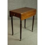 A Victorian mahogany work table with drop leaves and an end drawer, on turned legs. H.72 W.67 D.