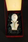 A boxed moulded miniature bust of Lady Diana mounted on a perspex base. H.20cm.