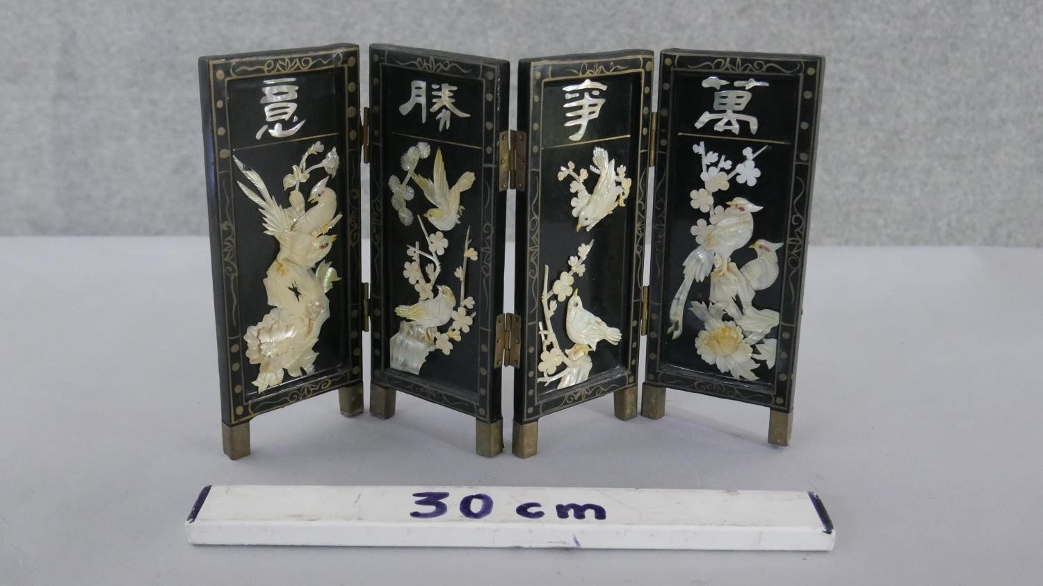 A miniature Japanese mother of pearl and lacquer folding screen. Decorated with birds, cherry - Image 2 of 2