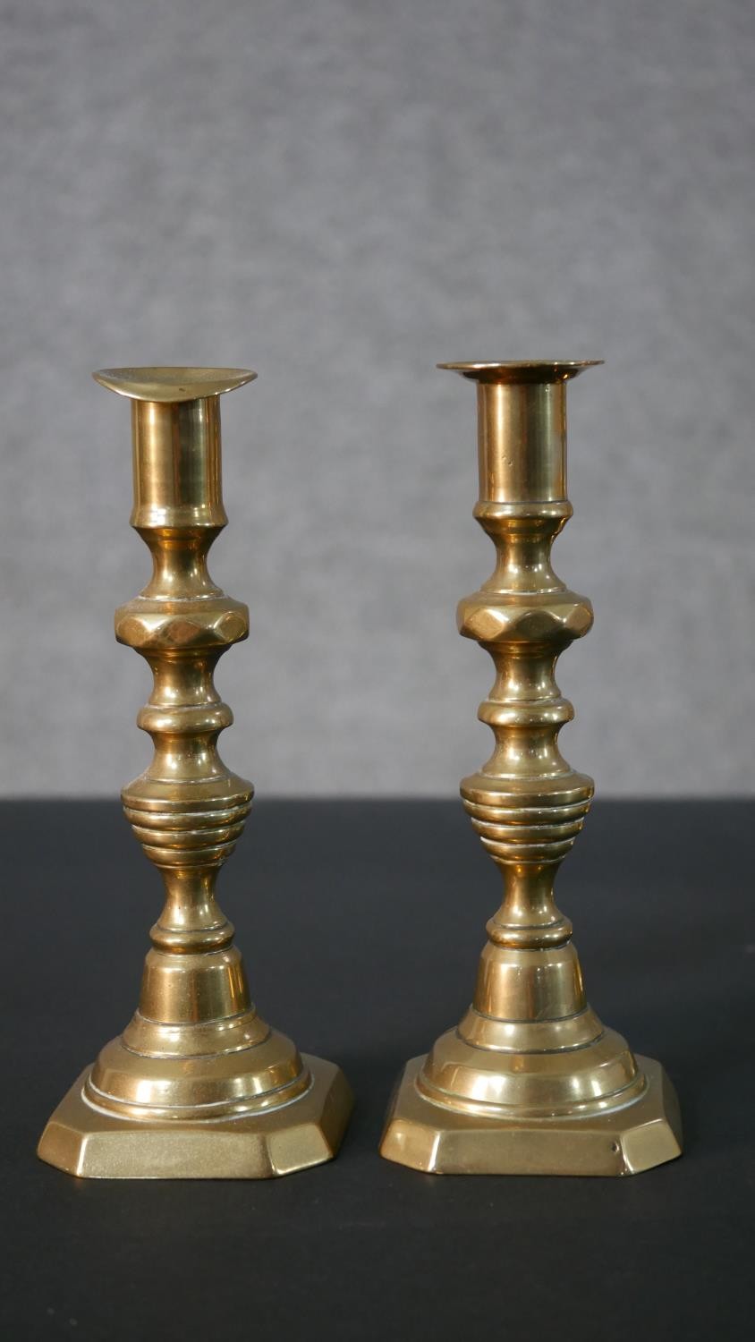 Two pairs of early 20th century brass candle sticks, one set with octagonal bases. H.27.5 W.11.5 D. - Image 5 of 7