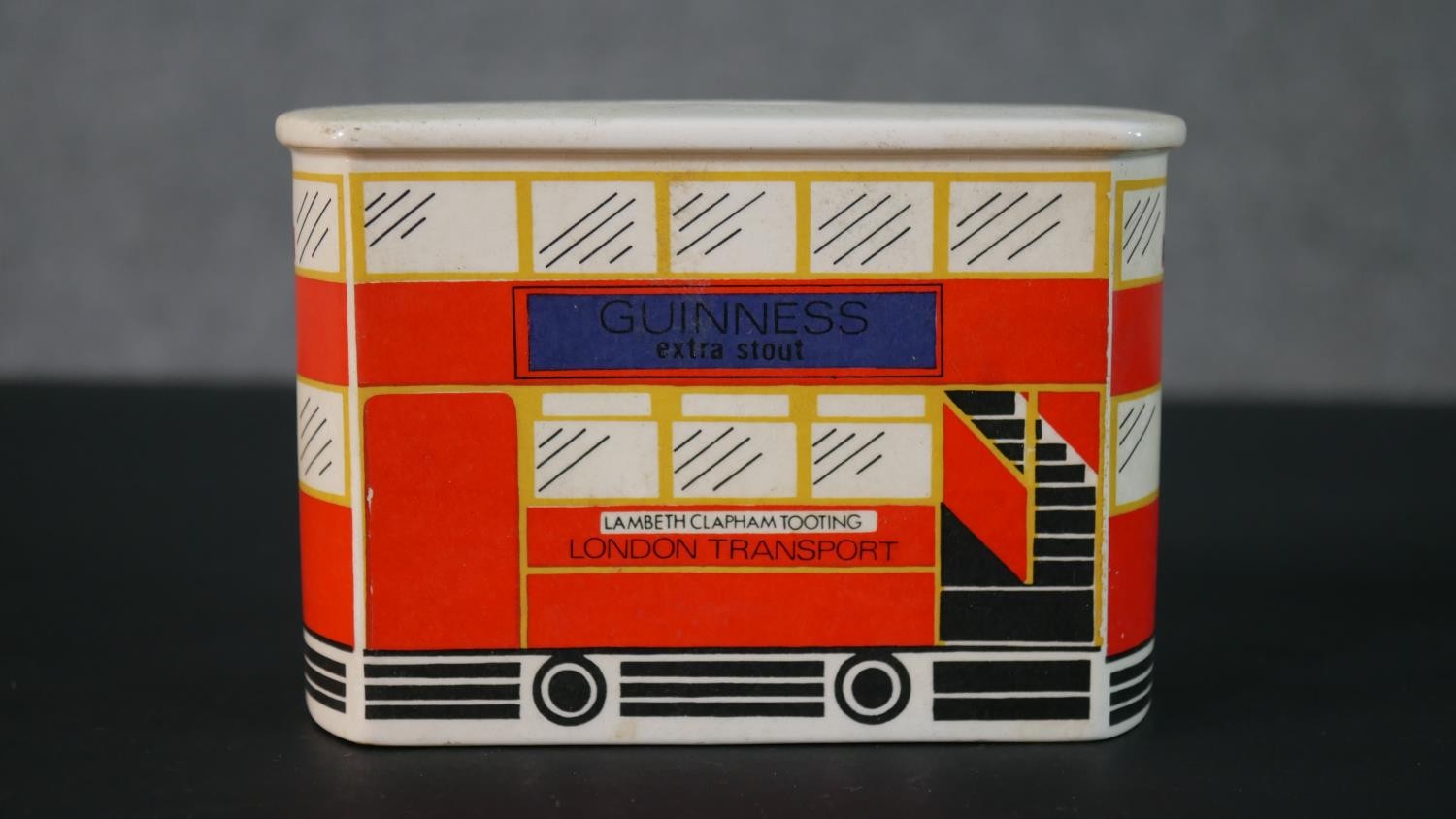 A Carlton Ware London bus Guinness ceramic money box along with a Guinness bottle design clothes - Image 2 of 10