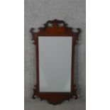 A George III style mahogany fretwork mirror, of typical design, with a rectangular mirror plate. H.