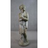 A reconstituted stone sculpture of a classical female in robes. H.116cm