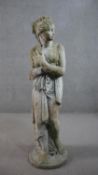 A reconstituted stone sculpture of a classical female in robes. H.116cm