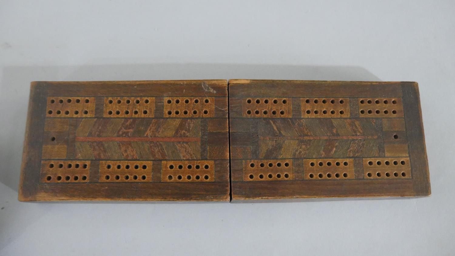 An early 20th century games box, with dominoes, cards and a cribbage set along with a marquetry - Image 3 of 6