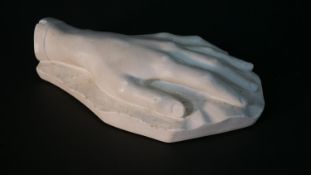 A 19th century plaster cast of a hand, signed Chopin 1802-1849. H.6 W.23 D.12cm