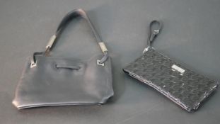 Two vintage bags with dust bags. A black geometric design Jaeger clutch bag and a Bally black
