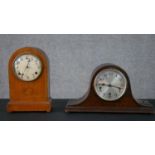 Two early 20th century mantel clocks, one with an oak case with white enamel dial and brass movement