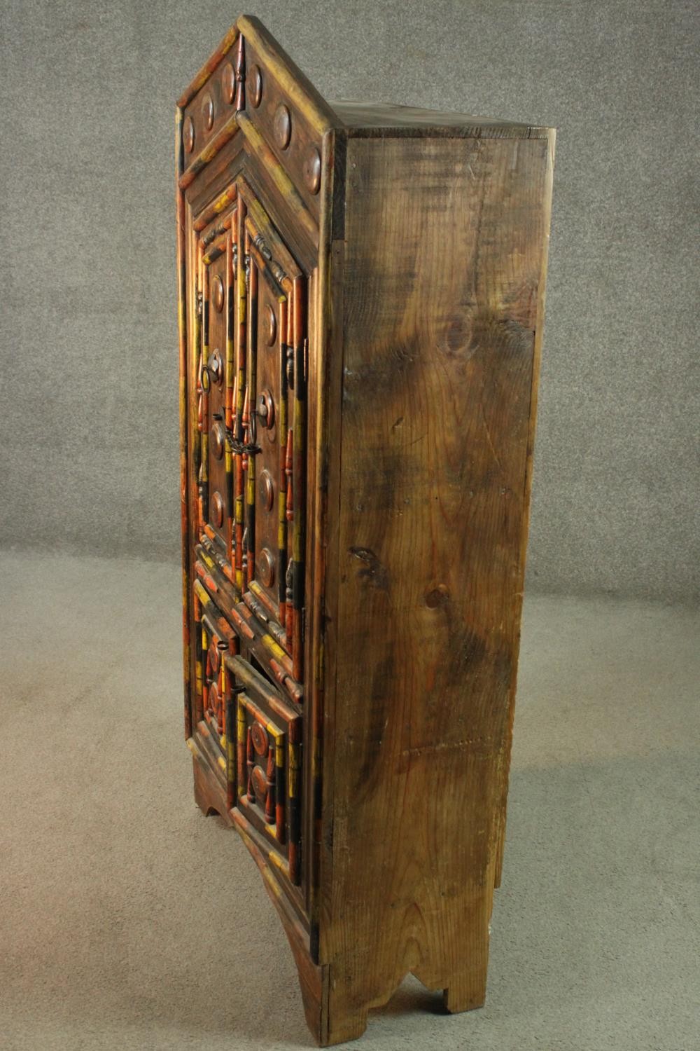 An Indian polychrome painted hardwood cupboard, with an arch top over two pairs of cupboard doors, - Image 7 of 7