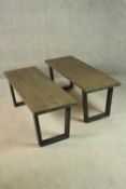 A pair of contemporary oak benches, of rectangular form, on end supports. H.45 W.117 D.42cm.
