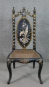 A Victorian black lacquered side chair, the oval back inlaid with mother of pearl to form a