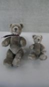 Two 20th century grey mohair jointed teddy bears, with suede pads. H.43 W.23cm (largest)