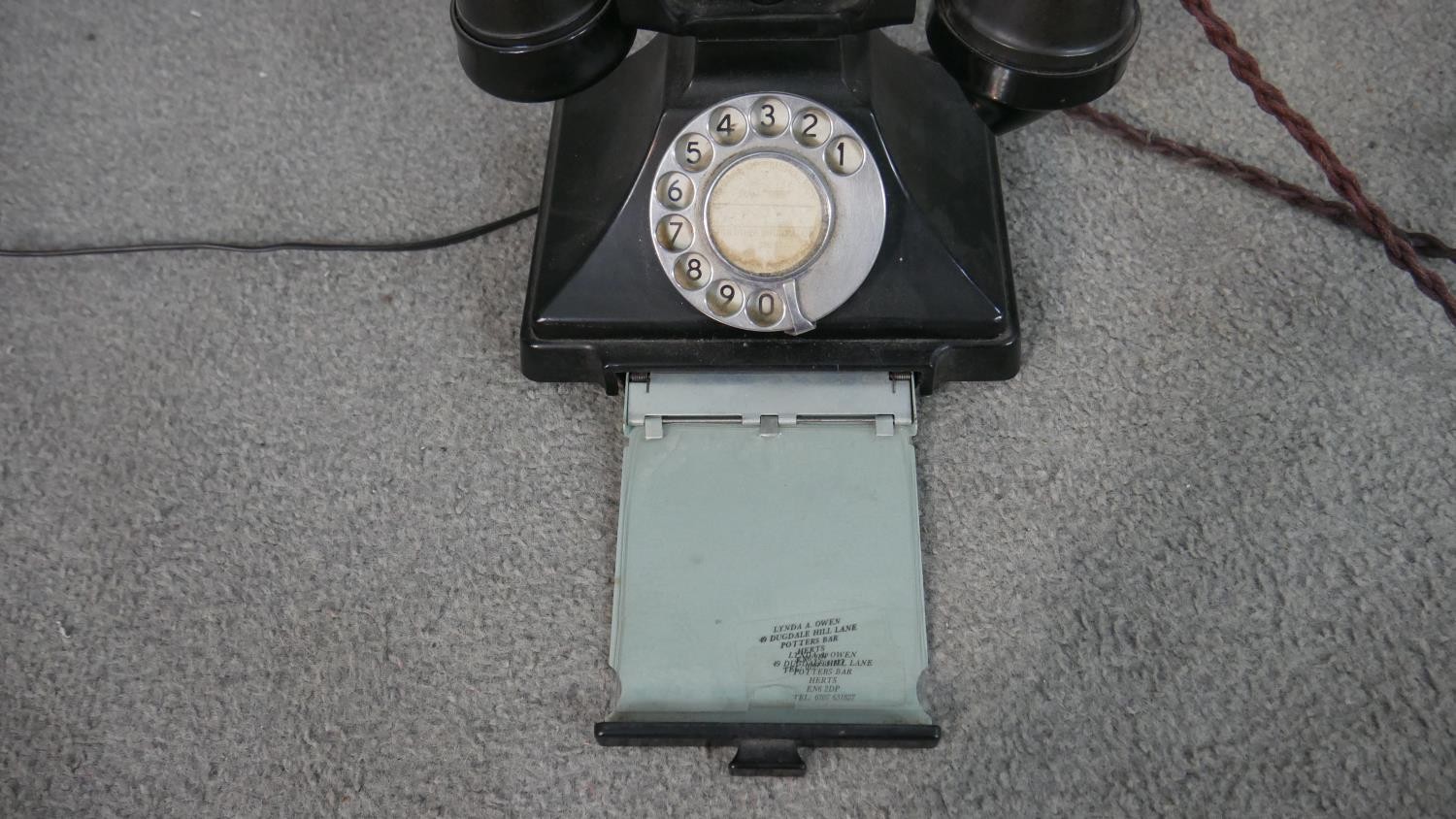 A vintage black Bakelite telephone with pull out note tray. H.16 W.18 D.14cm - Image 3 of 6