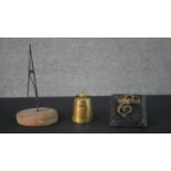 A novelty 19th century 2lb weight brass desk ink well along with two letter clips. H.22 Diam.11.