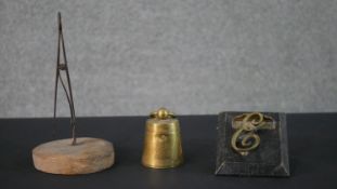 A novelty 19th century 2lb weight brass desk ink well along with two letter clips. H.22 Diam.11.