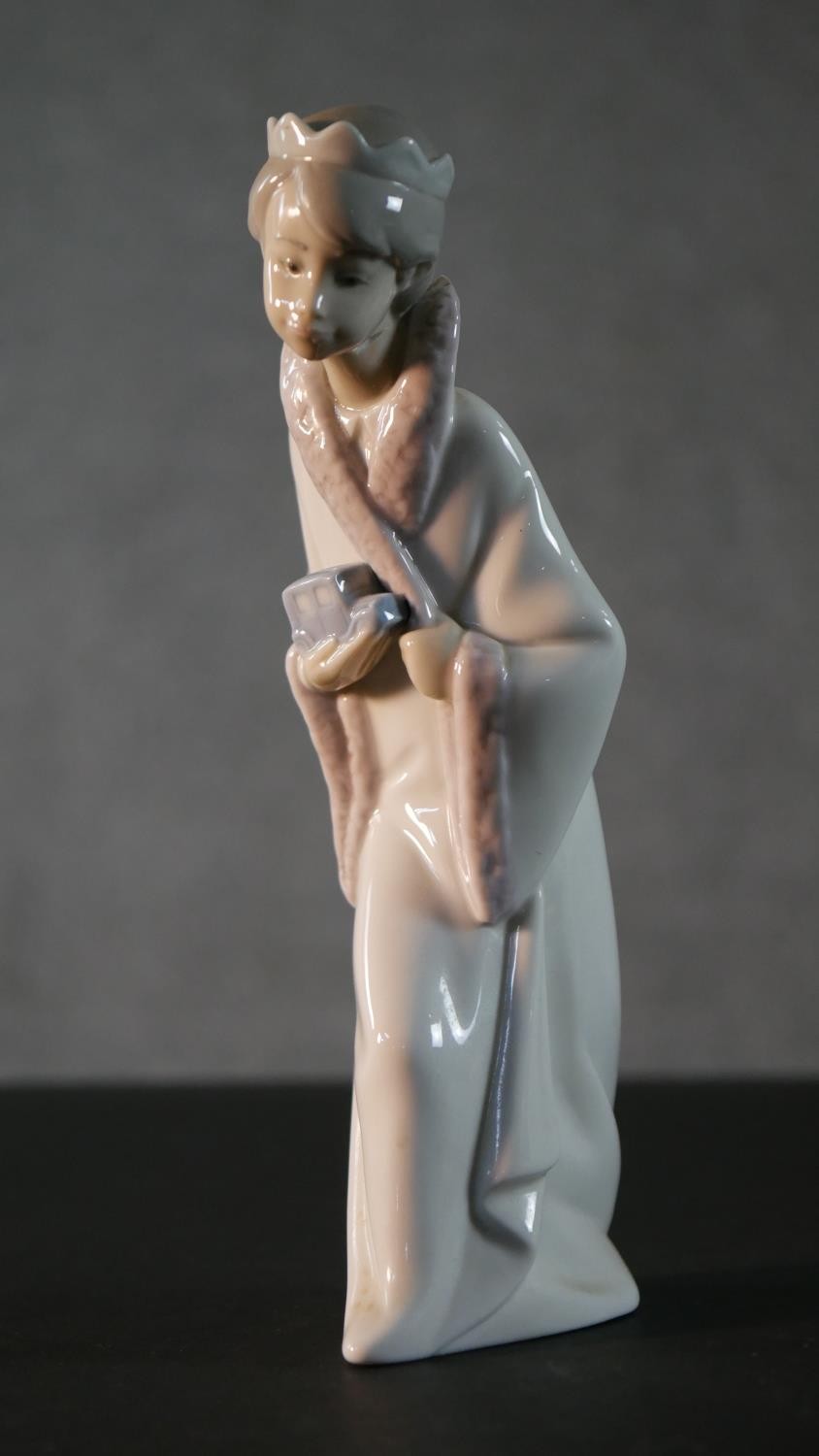 A collection of five Lladro porcelain figures, including a clown and puppy, girl with a lamb, boy in - Image 5 of 14