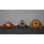 Three Art Deco mantle clocks. One of angular form with burr walnut veneer, one Metamec brown