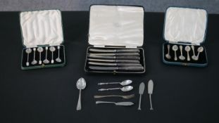 A collection of silver cutlery, including three cased sets of silver cutlery, two sets of coffee