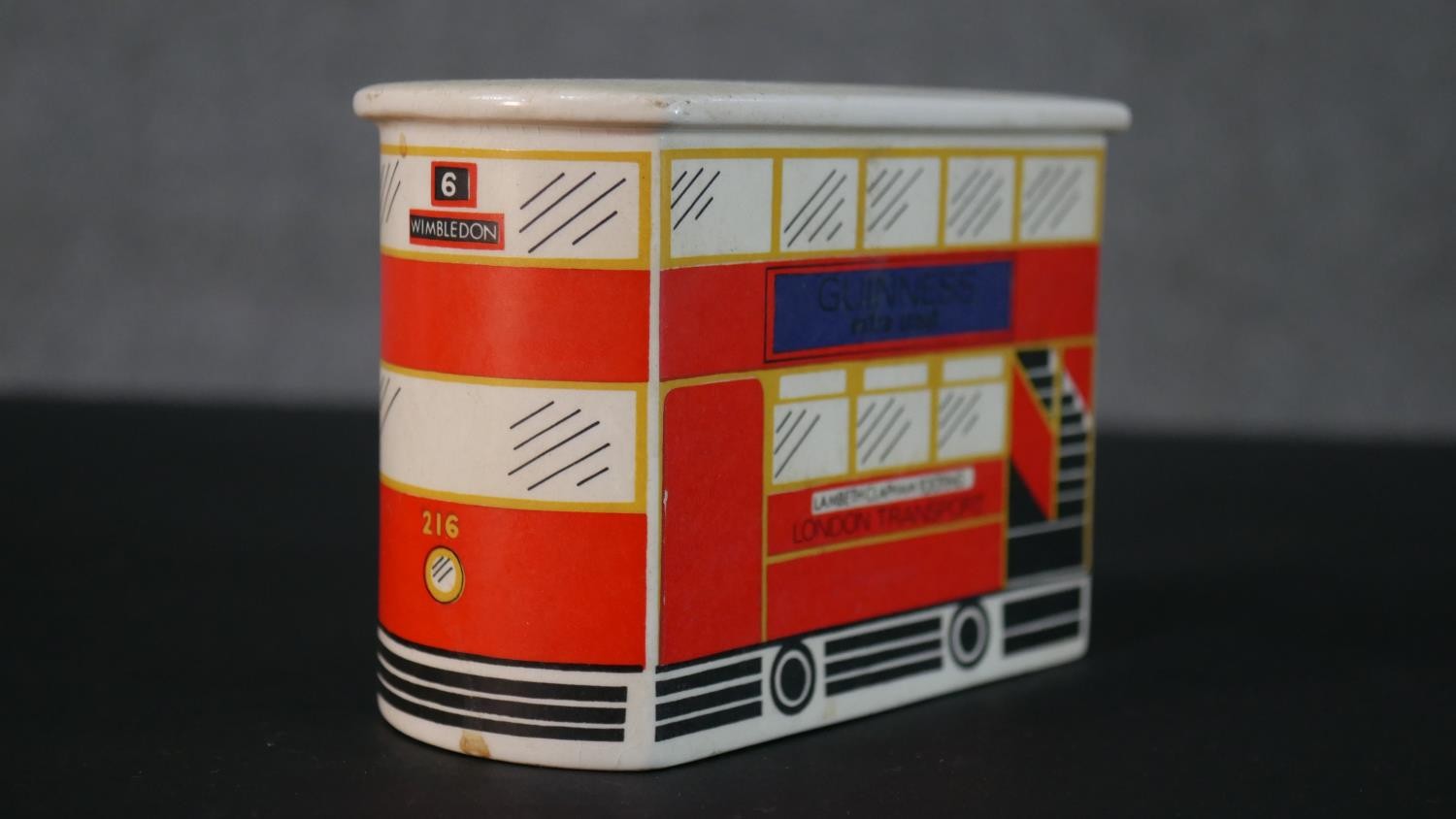 A Carlton Ware London bus Guinness ceramic money box along with a Guinness bottle design clothes - Image 4 of 10