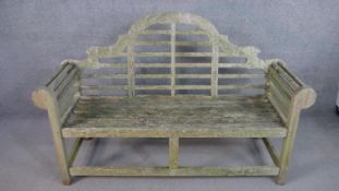 A Lutyens garden bench, weathered teak, originally designed by Sir Edwin Landseer Lutyens (British
