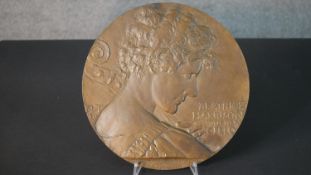 Robert Tait McKenzie (b.1867 - 1938), a relief bronze plaque of Beatrice Harrison with her cello,