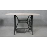 A contemporary table with limed oak top on wrought iron Singer sewing machine base C.1900. H.76 W.