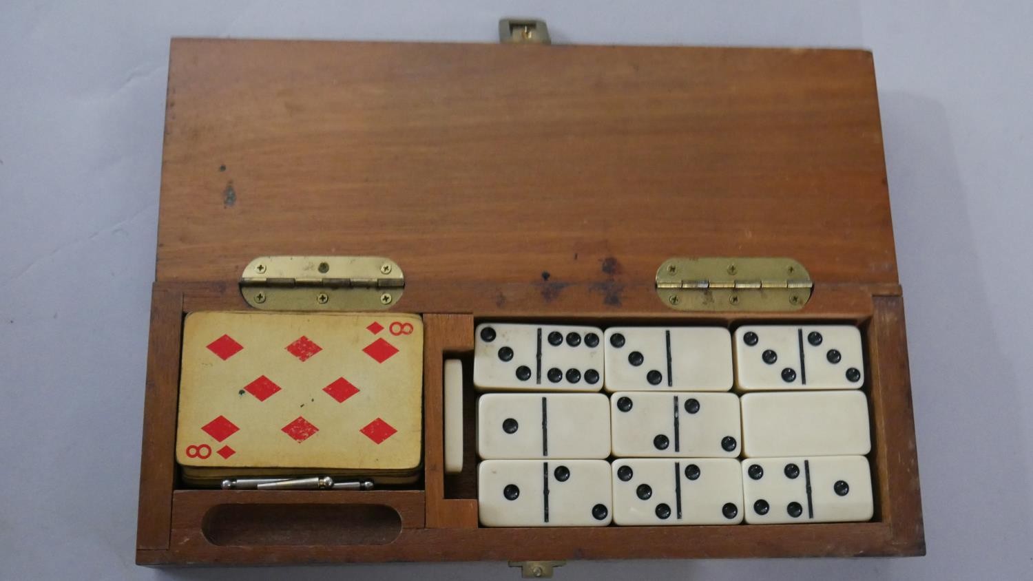 An early 20th century games box, with dominoes, cards and a cribbage set along with a marquetry - Image 6 of 6