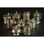 Nine sterling silver hinged lid mustard pots, various designs, makers and assay marks. (9pcs).