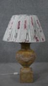 A ceramic stone effect classical design table lamp with relief fruit swag design. H.75 Diam.47cm