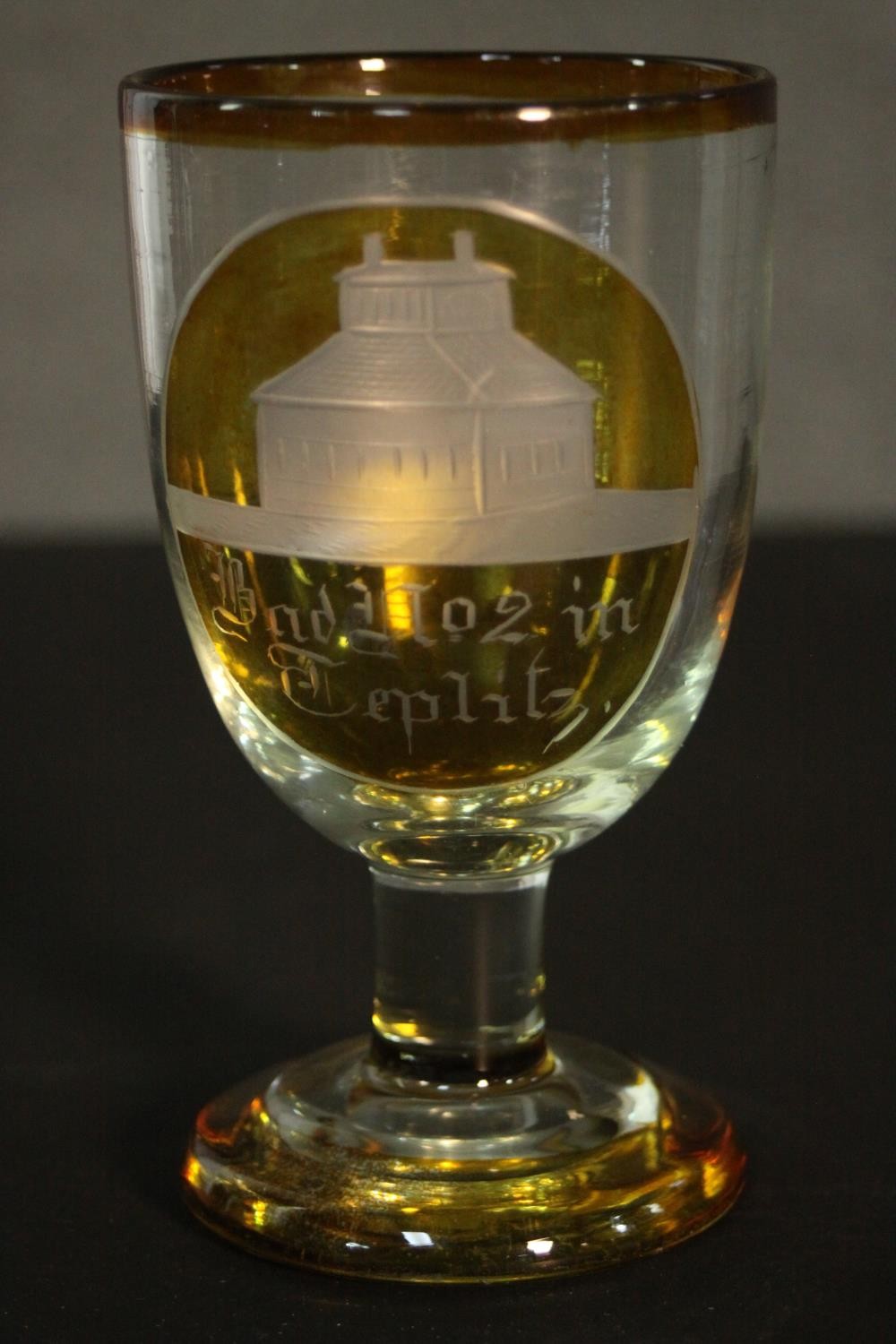 Two early 20th century Bohemian glass pieces. An amber painted clear glass etched rummer with a - Image 4 of 7