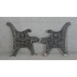 Two Victorian style painted cast iron bench ends. H.78 W.71cm