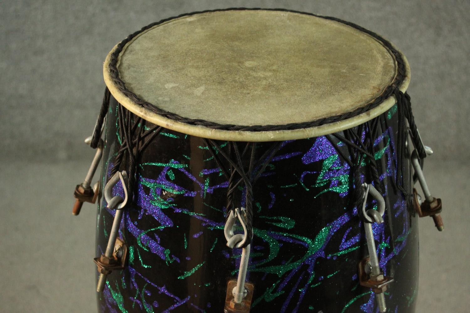 A purple and green glitter abstract design fibre glass Conga drum on wooden stand. H.92 W.31cm. - Image 3 of 4