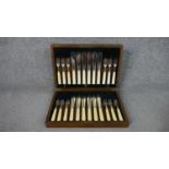 An oak canteen with a six person A1 silver plated set of fish knives and forks, makers mark FC&Co.