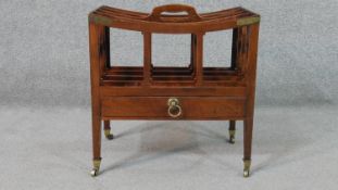 A George III mahogany Canterbury, with a central handle and four divisions over a single drawer,
