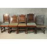 A collection of five early 18th century and earlier oak hall chairs with panel seats on
