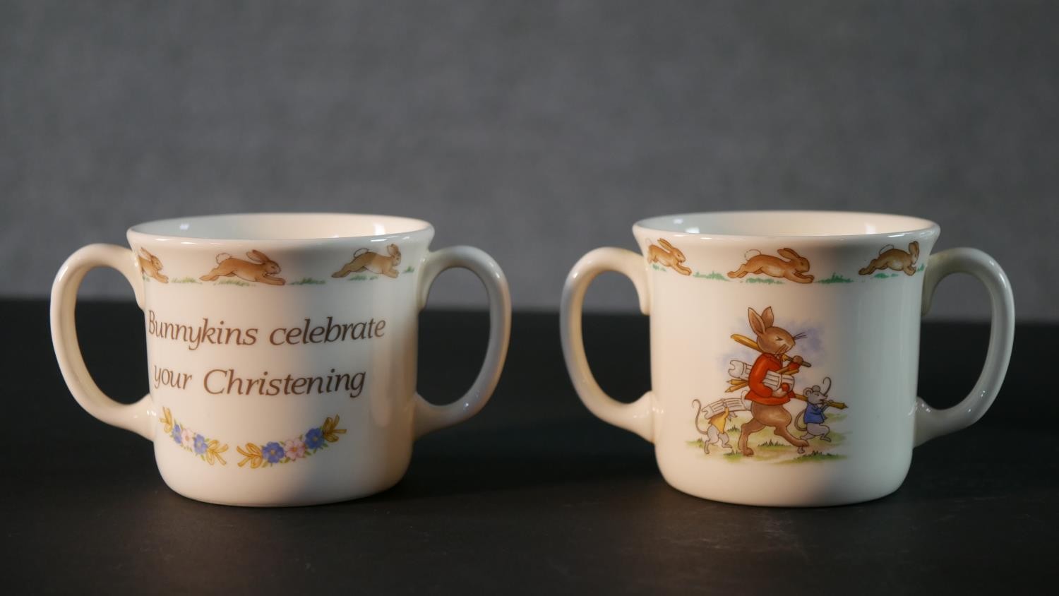 A collection of Royal Doulton Bunnykins pattern child's crockery, includes three cups, a moneybox, a - Image 2 of 16