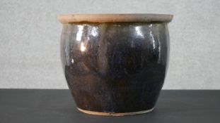 An art pottery drip glaze planter. Diam.39cm