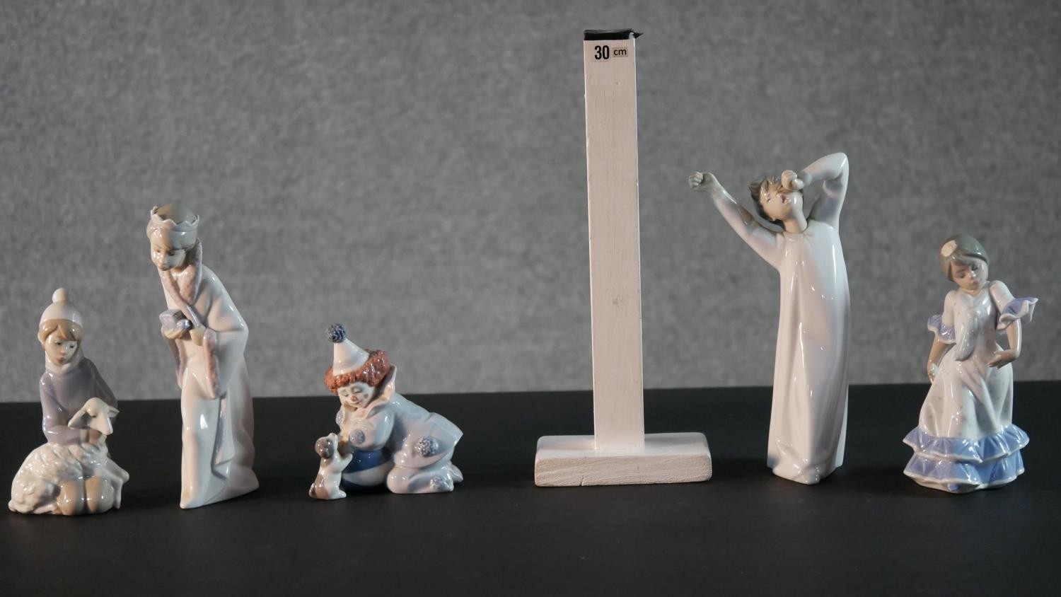 A collection of five Lladro porcelain figures, including a clown and puppy, girl with a lamb, boy in - Image 2 of 14