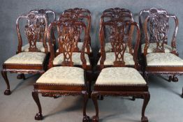 A set of ten Chippendale style mahogany dining chairs, with ornately detailed pierced splat backs,