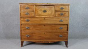 A George IV mahogany chest, with a central hat drawer, flanked by two pairs of short drawers, over