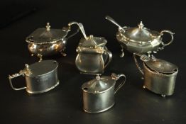 Six 19th and 20th century sterling silver hinged lid mustard pots, various designs, makers and assay
