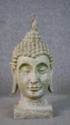 A 20th century concrete Buddha head. H.50 W.25 D.25cm