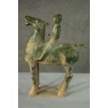 A Chinese Tang style green glaze clay horse and rider on rectangular base. H.69 W.53cm.