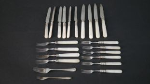 A set of Victorian silver plate cutlery some with mother of pearl handles. (22 pieces)
