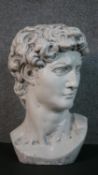 A 20th century painted plaster bust of Michael Angelo's David. H.41 W.25 D.25cm