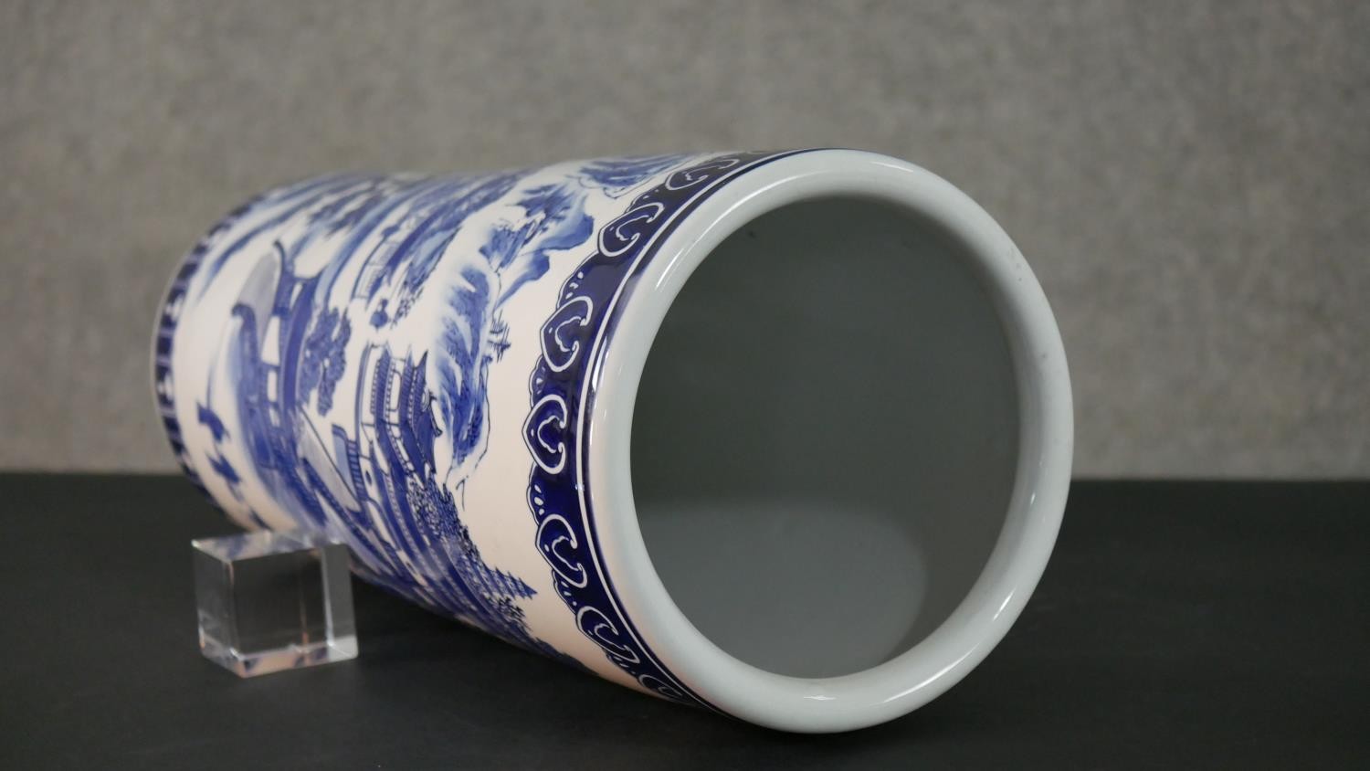 A 20th century blue and white Chinese porcelain stick stand decorated with a mountain landscape, - Image 8 of 9