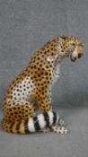 A vintage Ronzan large fireside hand painted pottery model of a cheetah, signed to the base. H.37