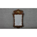 A George III mahogany fretwork mirror, parcel gilt, with a carved and pierced, Ho-ho bird, and a