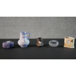 A collection of five Wedgwood pieces, including a Jasperware horse paperweight, a classical design
