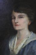 A gilt framed early 20th century oil on canvas portrait of an Edwardian lady, indistinctly signed